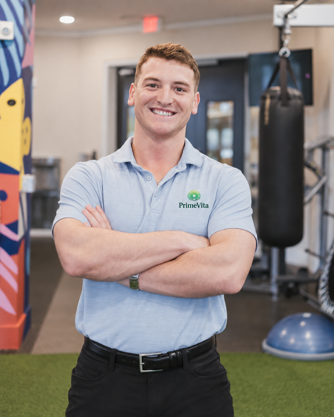Dr. Parker LaMarch smiling at the camera in a PrimeVita polo